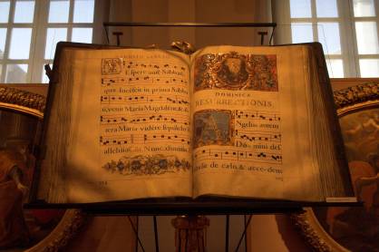 Huge liturgical book with very large writing and music, richly illuminated