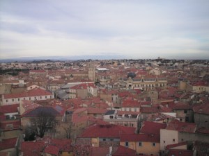 Old Town of Beziers, with red roofs dominating, landscape round horizon.