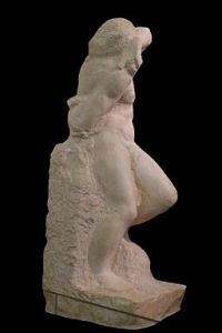 Statue of young man, unfinished, as if the figure were wrestling itself free of the stone.