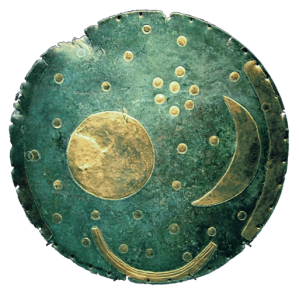 Ancient metal disk, deep green, showing golden celestial bodies.
