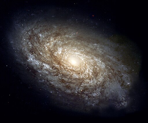Spiral galaxy, dense around luminous core.